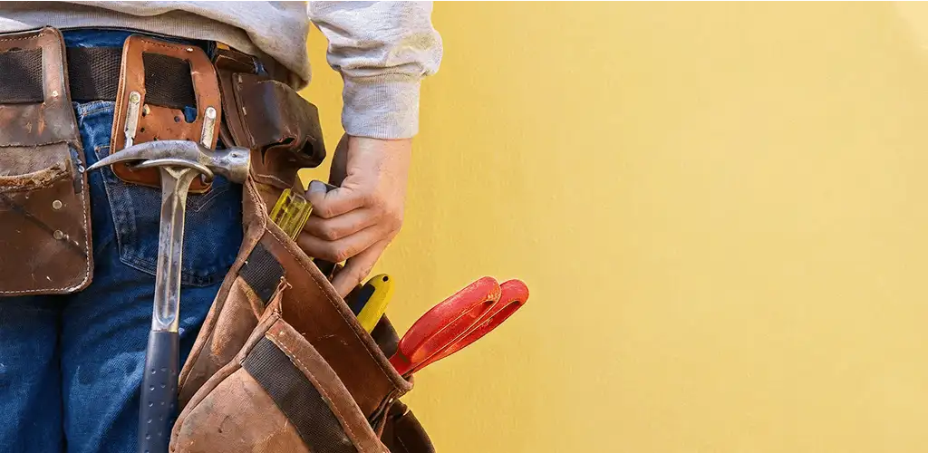 Handyman with tool belt ready for home repairs and maintenance in Lakeland, FL